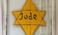 Painted Window Depicting a Jewish Identification Badge, displaying the names of Holocaust Survivors 