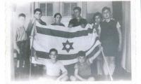 Photo Young Werner and others with the flag of Israel 