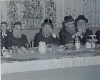 Rabbi Eliezer Silver Sitting Next to Rabbi Moshe Feinstein at an Unidentified Wedding