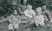Unidentified woman and children